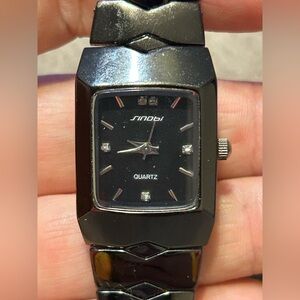 Black Sinobi analogue watch with diamond like detailing working new battery